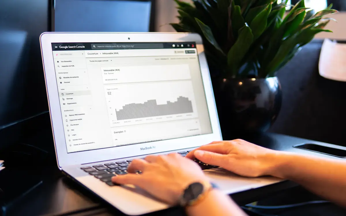 About Us 4 Google Search Console report on a laptop, used for SEO strategy work