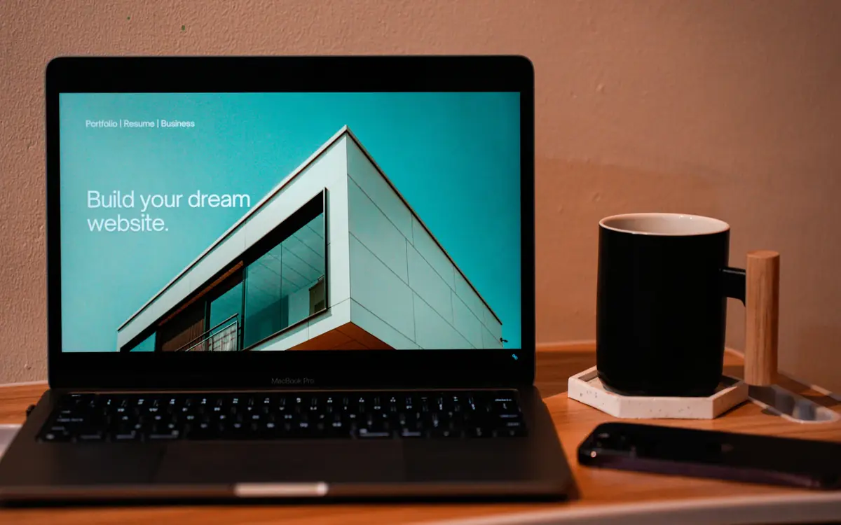 Laptop on a desk showing a website page being optimized with on-page SEO services